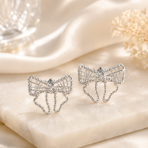 Silver Filigree Ribbon Bow Stud Earrings in 925 sterling silver – side view