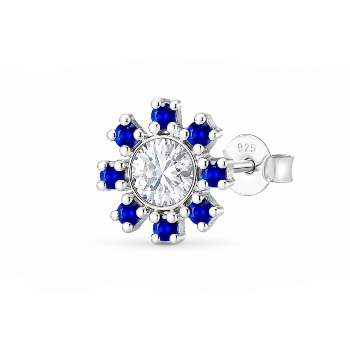 A single floral cluster stud earring featuring a central clear round-cut gemstone surrounded by eight deep blue round-cut gemstones in a silver-toned setting, with a visible post and backing stamped 925.