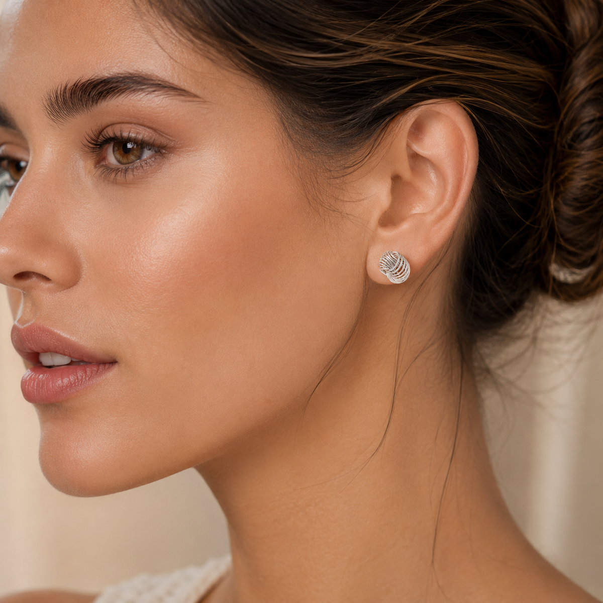 Celestial Spiral Knot Stud Earrings in 925 sterling silver – angle view