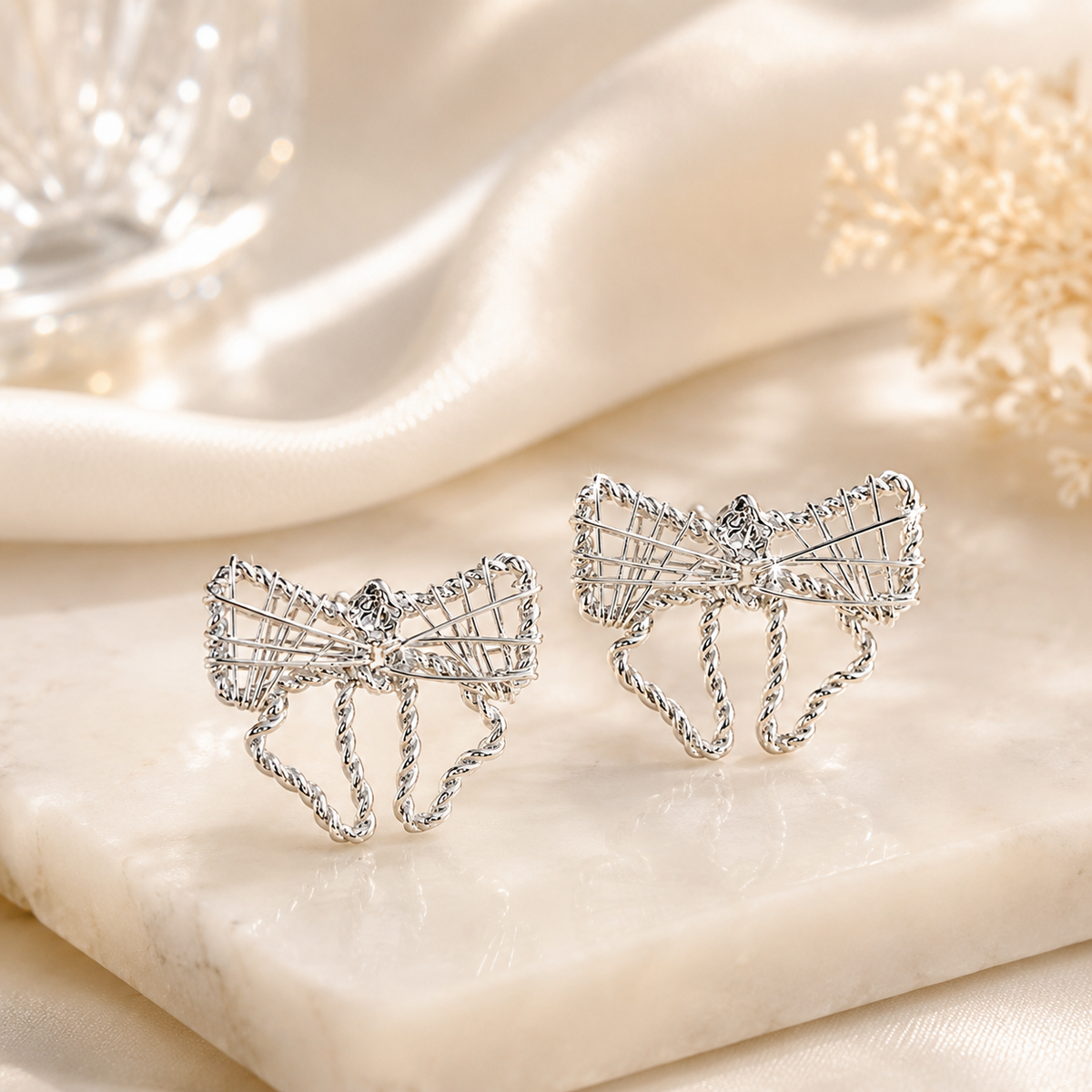 Silver Filigree Ribbon Bow Stud Earrings in 925 sterling silver – side view