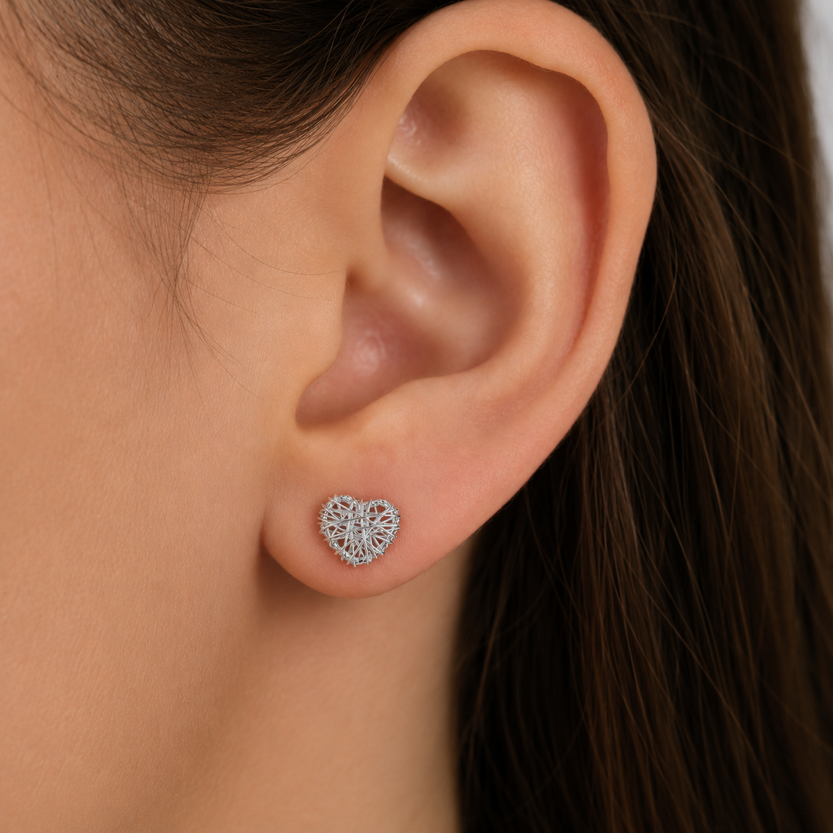 Sterling Silver Woven Heart Stud Earrings in 925 sterling silver – angle view